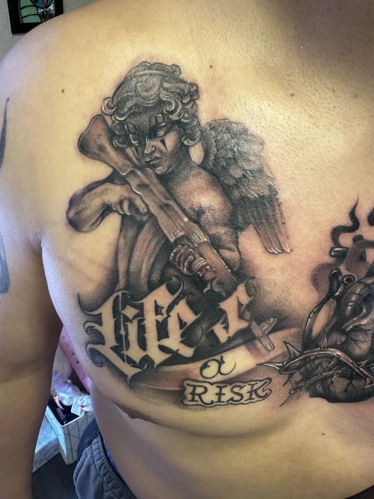 Cherub with cross