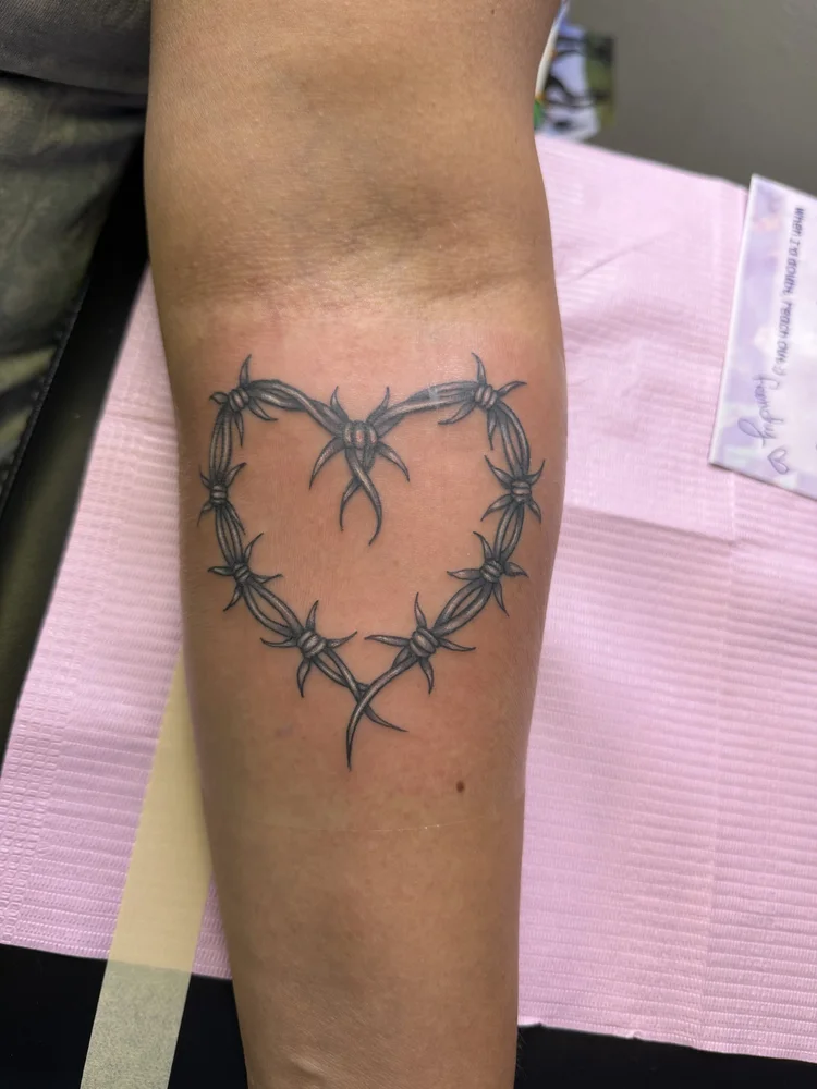 Barbed wire heart tattoo